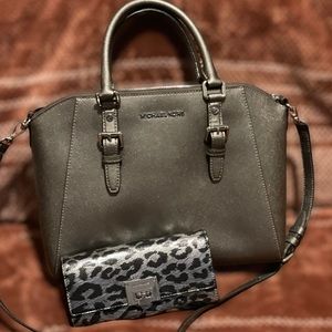 Michael Kors Bag with button close wallet.